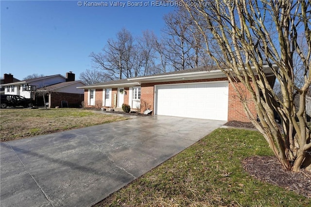 single story home featuring a garage, brick siding, concrete driveway, and a front yard