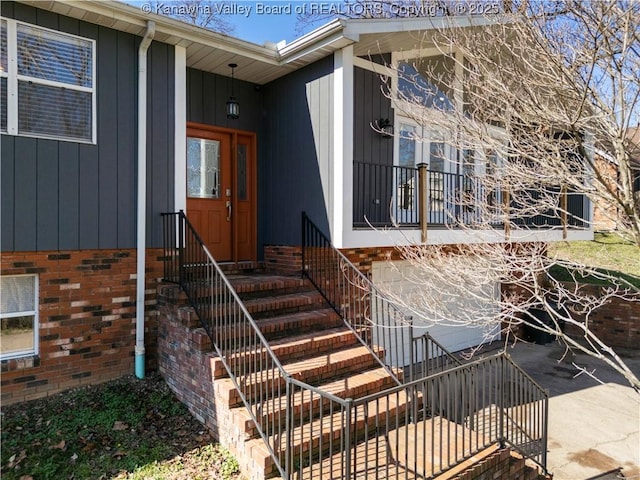 doorway to property with brick siding