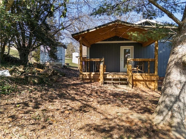 view of outbuilding featuring covered porch