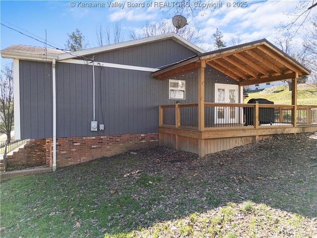 view of property exterior with a deck