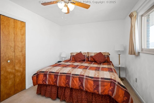 carpeted bedroom with baseboards and ceiling fan