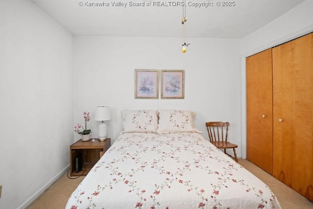 bedroom with light carpet and a closet