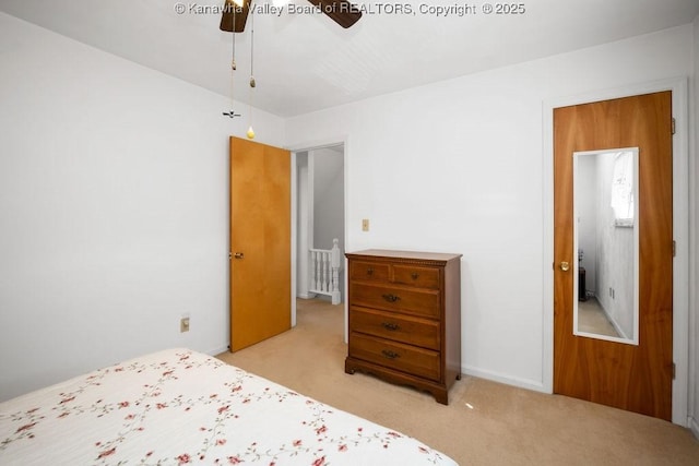 carpeted bedroom featuring ceiling fan