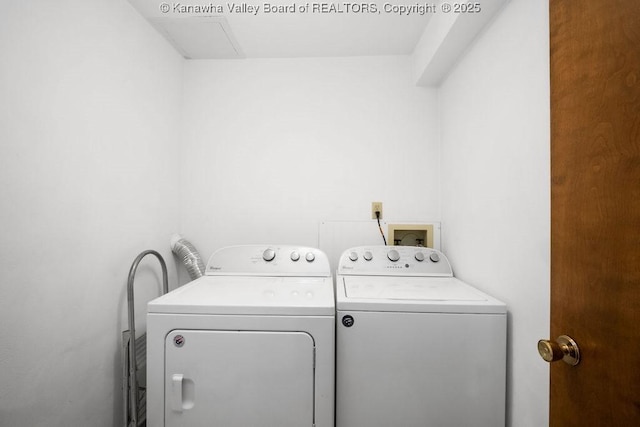 clothes washing area with laundry area and washer and clothes dryer