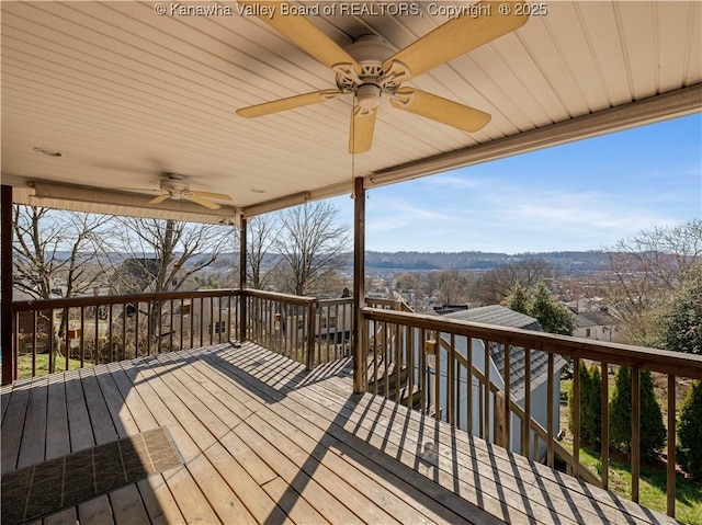 wooden deck featuring ceiling fan