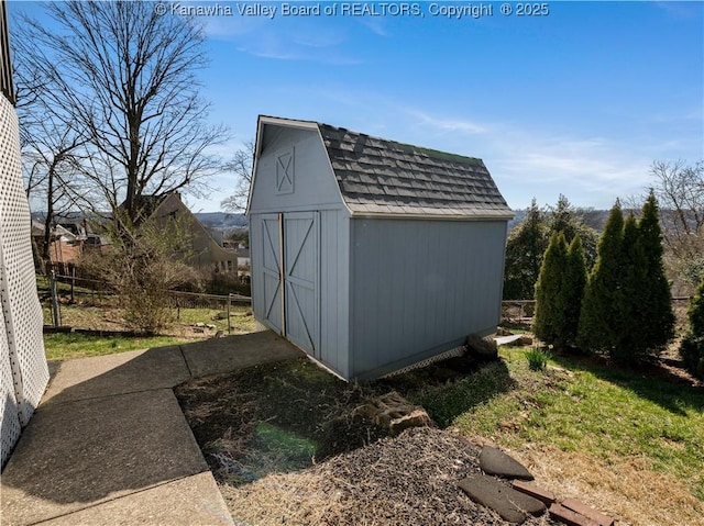 view of shed with fence