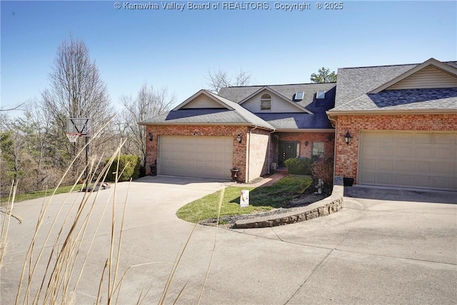 view of front of house featuring brick siding, concrete driveway, a garage, and a shingled roof