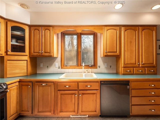 kitchen with visible vents, black dishwasher, decorative backsplash, brown cabinetry, and a sink