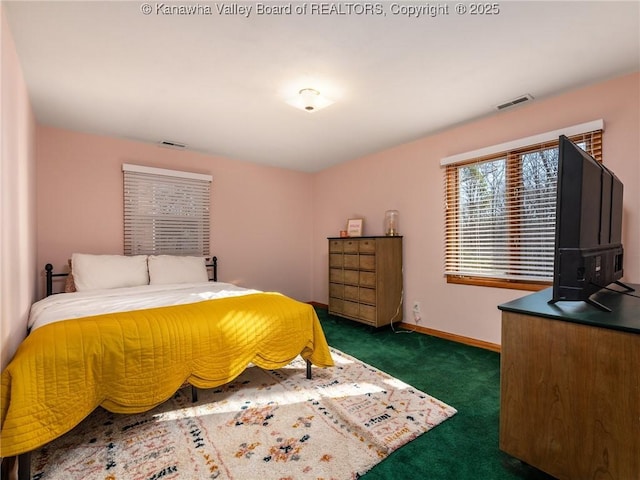 bedroom with carpet, visible vents, and baseboards