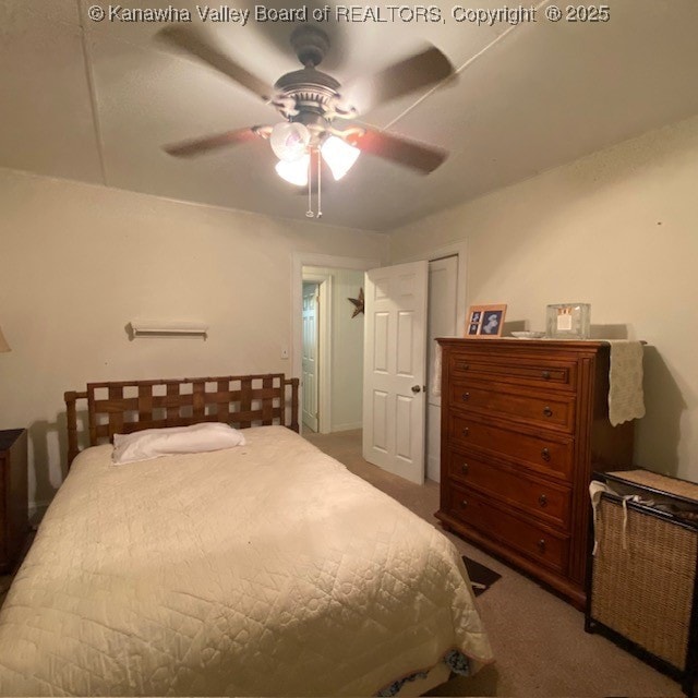 carpeted bedroom featuring ceiling fan