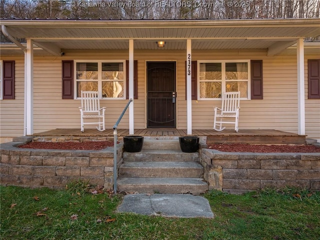 view of exterior entry featuring a porch