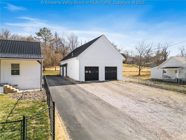 detached garage with fence