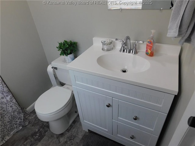 bathroom with vanity and toilet