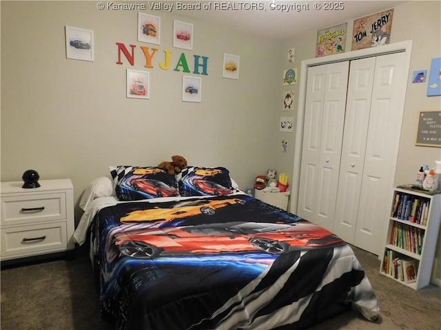 bedroom featuring a closet and dark carpet