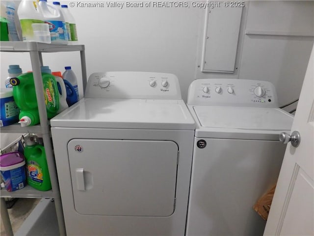 washroom with separate washer and dryer and laundry area