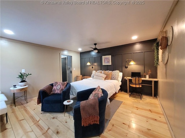 bedroom with recessed lighting, baseboards, light wood-style floors, and crown molding