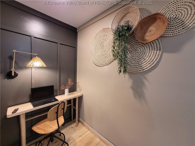 office with wood finished floors and baseboards