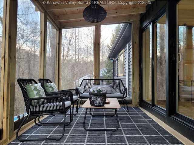 sunroom / solarium featuring wooden ceiling