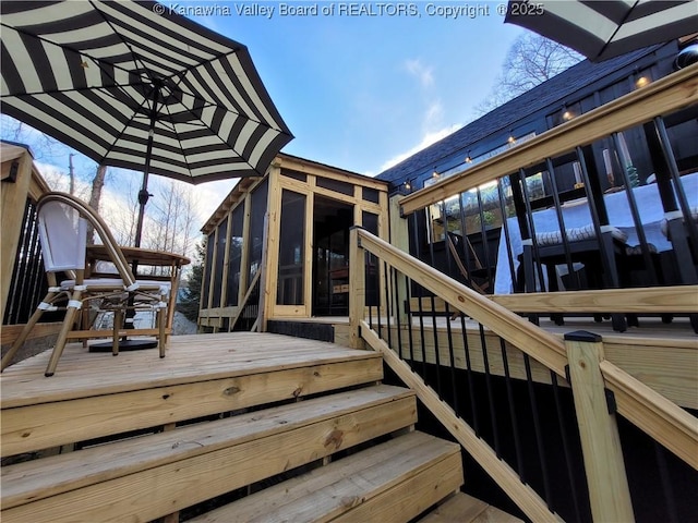 wooden terrace with a sunroom