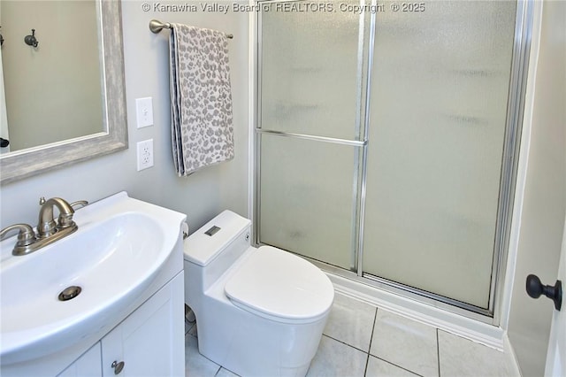 full bath featuring vanity, toilet, a stall shower, and tile patterned flooring