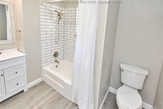 full bath with vanity, wood finished floors, baseboards, toilet, and shower / tub combo with curtain