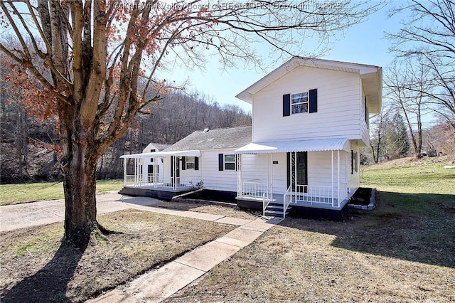 view of front facade with a porch and a front yard