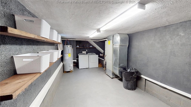 finished basement with washer and dryer, heating unit, electric water heater, and a textured ceiling