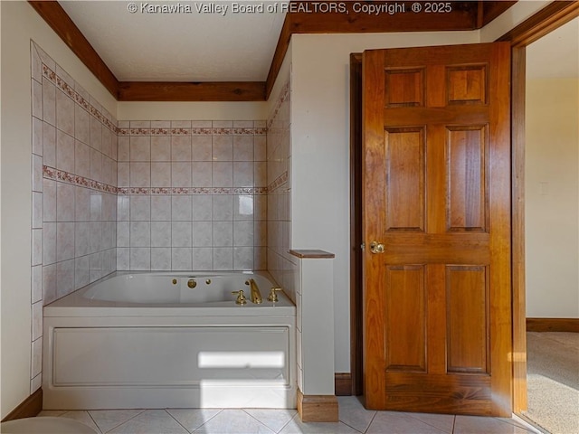 bathroom with tile patterned flooring and a whirlpool tub