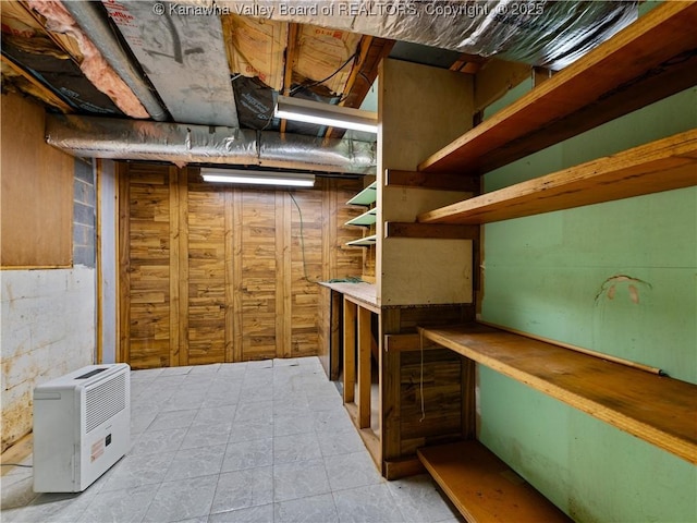 unfinished basement with concrete block wall