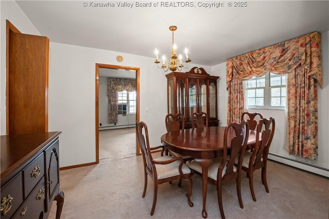 dining space featuring a healthy amount of sunlight, light colored carpet, a baseboard heating unit, and an inviting chandelier