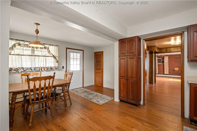 dining space featuring light wood-type flooring