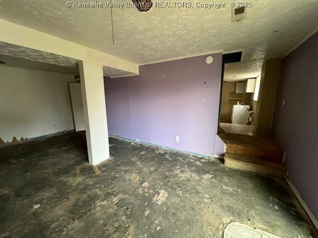 interior space with a textured ceiling