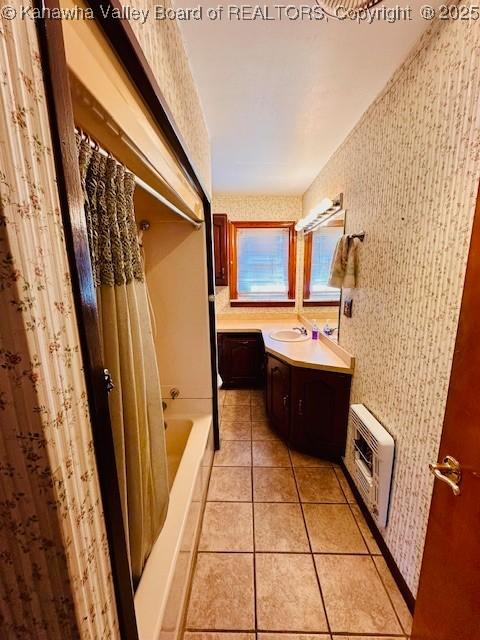 bathroom featuring heating unit, tile patterned floors, wallpapered walls, and vanity