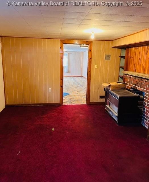 interior space with wooden walls and carpet