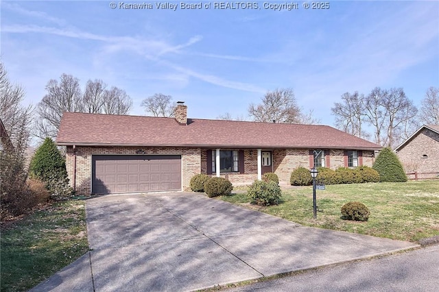 single story home featuring a front yard, a chimney, concrete driveway, a garage, and brick siding