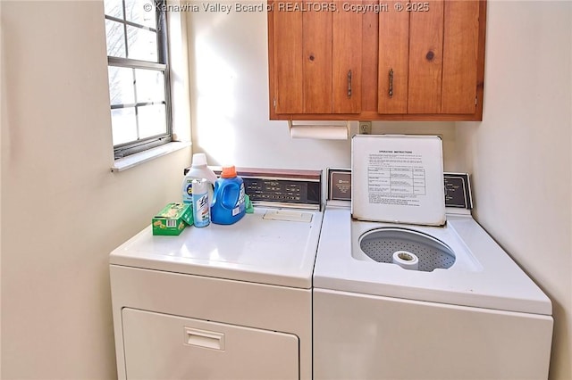 laundry room with washer and dryer and cabinet space