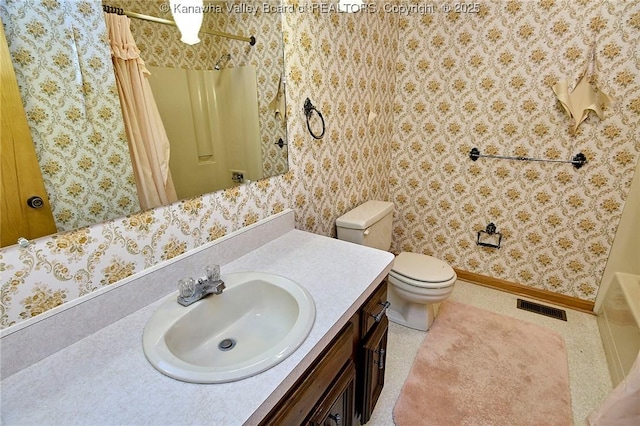 bathroom with visible vents, toilet, wallpapered walls, baseboards, and vanity