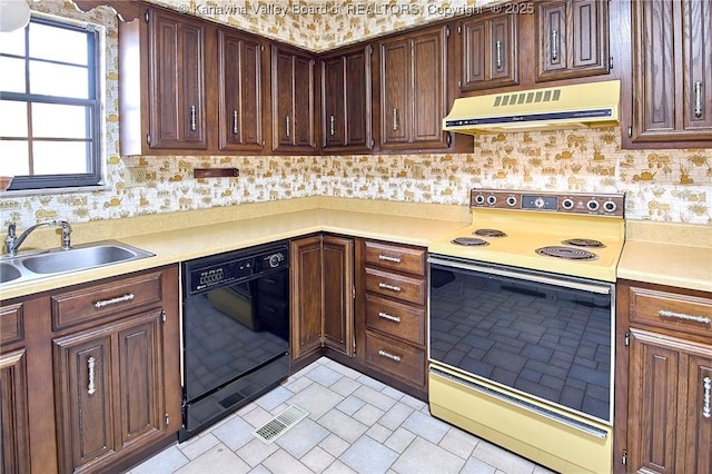 kitchen with white range with electric cooktop, a sink, black dishwasher, exhaust hood, and light countertops