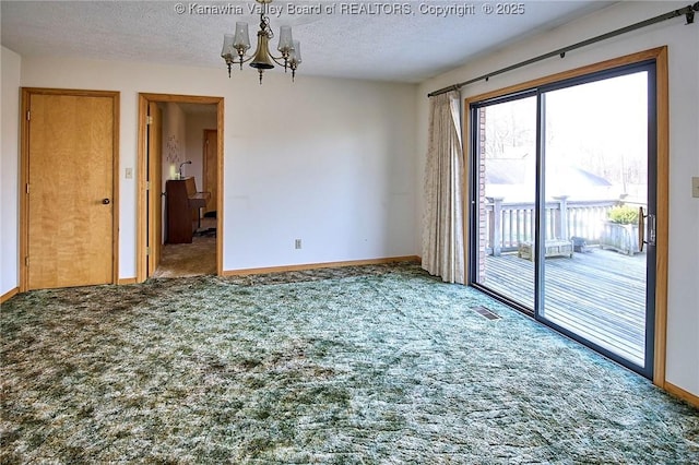 unfurnished room featuring baseboards, visible vents, a notable chandelier, a textured ceiling, and carpet flooring