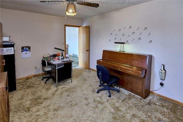 office space featuring baseboards, a textured ceiling, and carpet