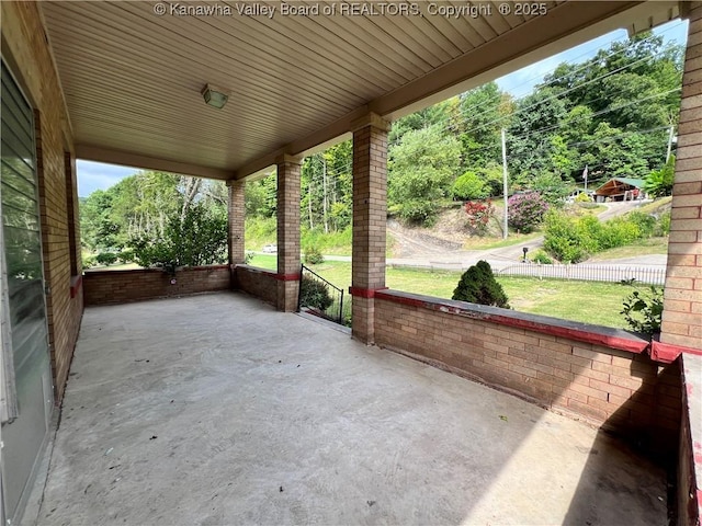 view of patio featuring fence