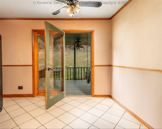 interior space featuring french doors, baseboards, ornamental molding, and a ceiling fan