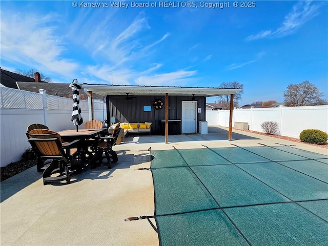 exterior space featuring outdoor dining area and fence