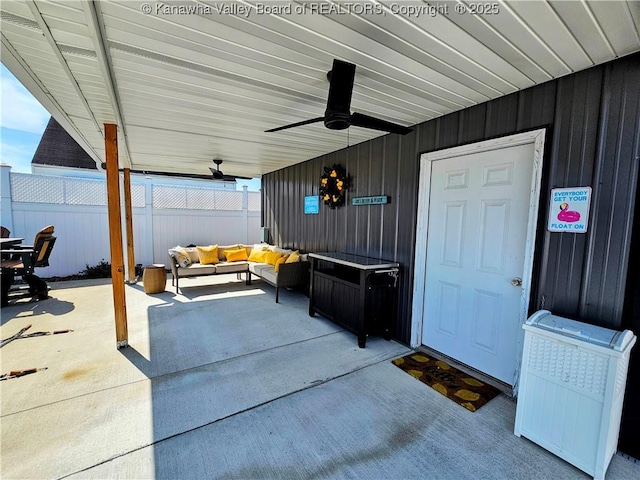 view of patio with outdoor lounge area and fence