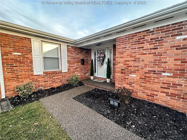 entrance to property with brick siding