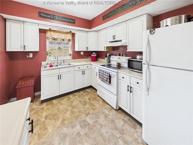 kitchen featuring under cabinet range hood, white cabinets, white appliances, and a sink