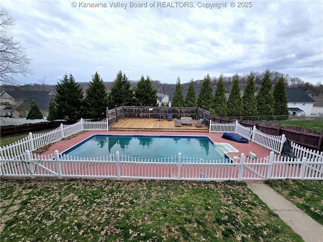 view of pool featuring a fenced in pool, a wooden deck, and a fenced backyard