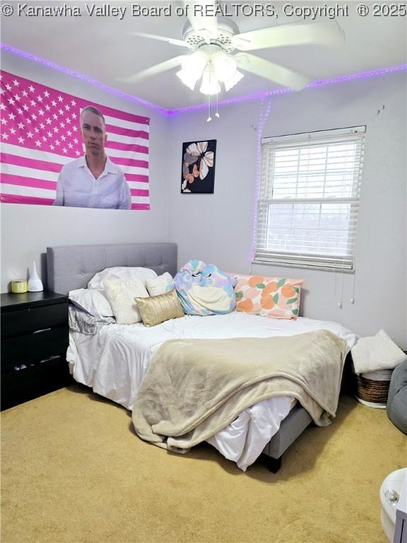 carpeted bedroom with a ceiling fan