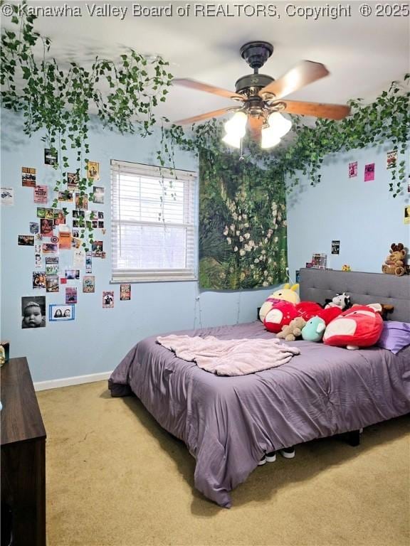 bedroom featuring baseboards, ceiling fan, and carpet floors