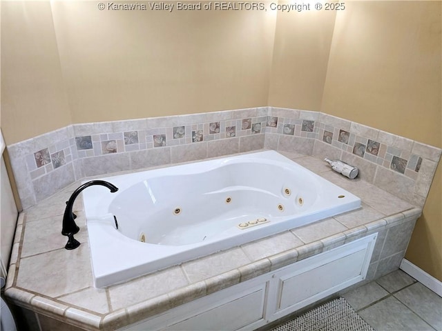 bathroom featuring tile patterned flooring and a whirlpool tub